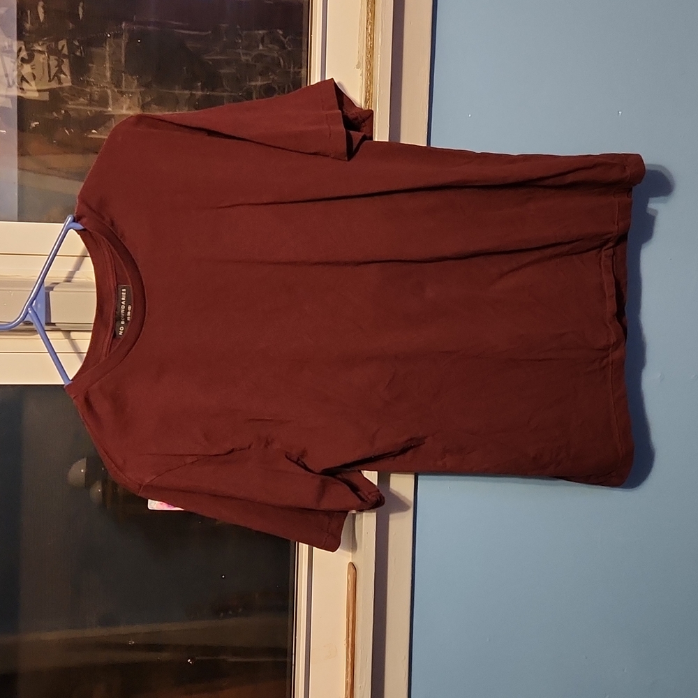 Believe it was from the male section. Maroon tshirt. No damage, or stains.